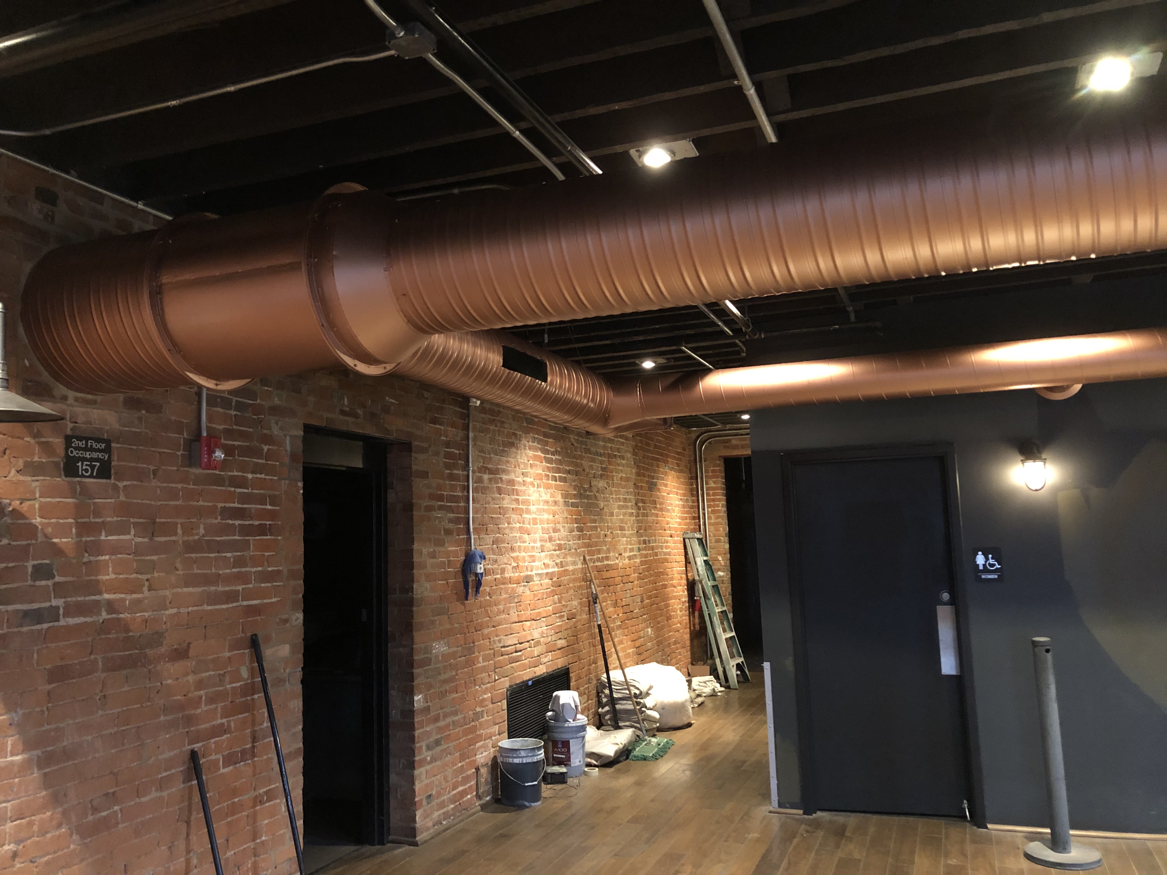 Commercial interior painting with exposed brick